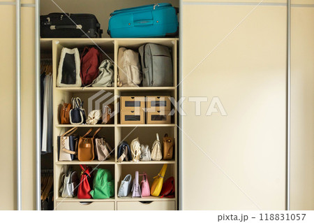 There are many fashionable, trendy, bright and colorful bags in your home wardrobe. There are many fashionable, trendy, bright and colorful bags in your home wardrobe. 118831057
