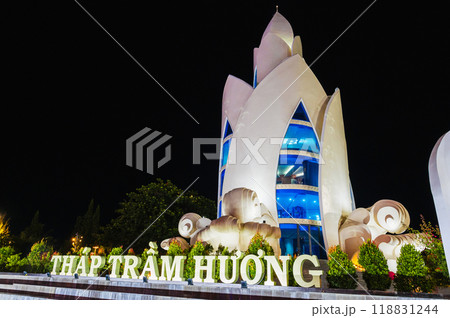 Landmark white Lotus Tower or Thap Tram Huong Tower in Nha Trang city on waterfront at night in Vietnam 118831244