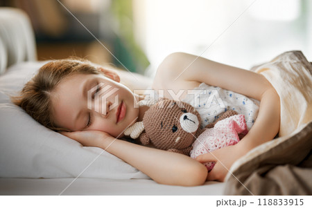 child is sleeping in the bed child is sleeping in the bed 118833915