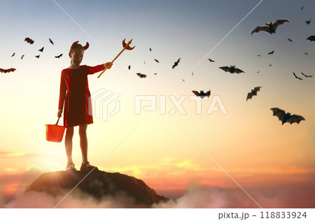 girl in devil costume at Halloween girl in devil costume at Halloween 118833924
