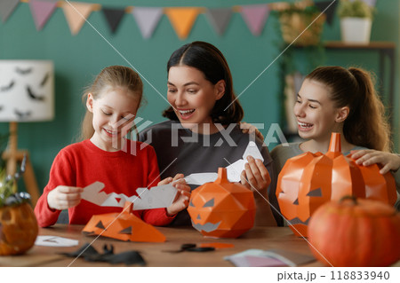Happy family preparing for Halloween. 118833940