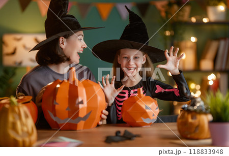 Happy family preparing for Halloween. Happy family preparing for Halloween. 118833948