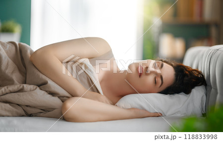 woman is sleeping in the bedroom 118833998