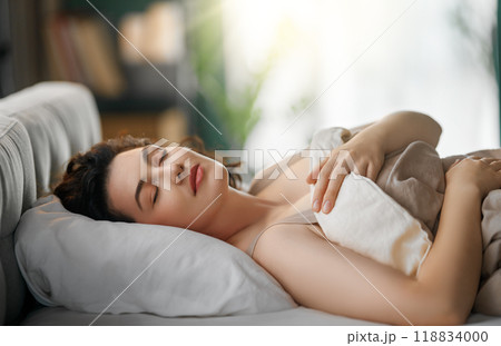 woman is sleeping in the bedroom 118834000