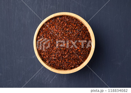 Red chili powder in bowl on black background, Food ingredient, Top view Red chili powder in bowl on black background, Food ingredient, Top view 118834082