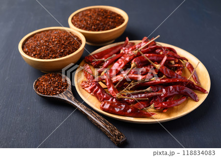 Dried red chili and chili powder in bowl on black background, Food ingredient Dried red chili and chili powder in bowl on black background, Food ingredient 118834083