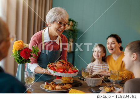 Family celebrating Thanksgiving Day Family celebrating Thanksgiving Day 118834363