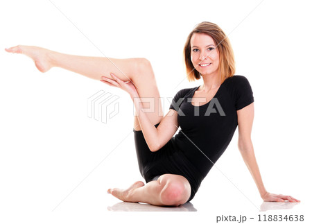 Sport Young woman doing exercise isolated on white Sport Young woman doing exercise isolated on white 118834638