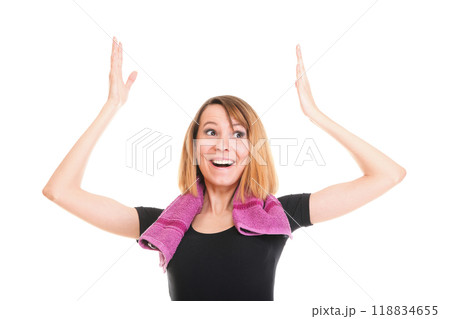 Fitness woman jumping excited isolated female smiling showing muscles Fitness woman jumping excited isolated female smiling showing muscles 118834655