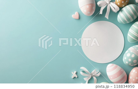 Colorful Easter decorations with a bunny figurine and pastel eggs on a blue background 118834950