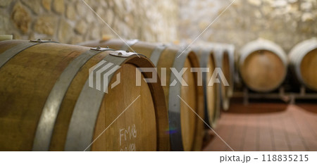 Wine cellar with oak barrels for aging wine. Traditional wine storage. 118835215