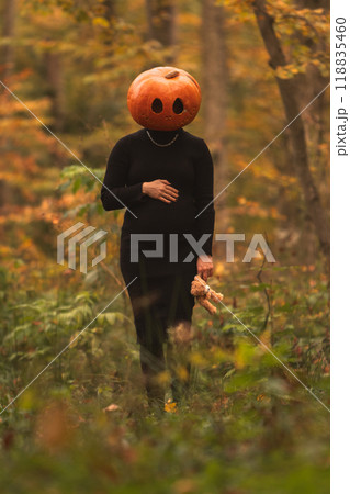 Surreal Pumpkin Head in Autumn Forest 118835460