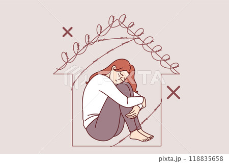 Woman victim of domestic violence sits in prison shaped like barbed wire house, in need of support Woman victim of domestic violence sits in prison shaped like barbed wire house, in need of support 118835658