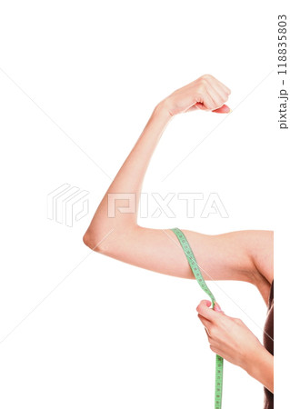 Fitness woman jumping excited isolated female smiling showing muscles 118835803