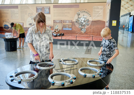 Educational Adventure for Kids at Valencia's Science Museum Featuring Innovative Displays and Interactive Experiences. Young Explorers Engaged in Interactive Learning at Valencia's Science Museum 118837535