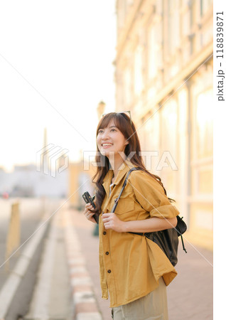 Traveler asian woman in her 30s enjoying travel in Bangkok, Thailand. Journey trip lifestyle, world travel explorer or Asia summer tourism concept. 118839871