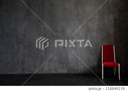 One old vintage chair in the interior of an empty gray room One old vintage chair in the interior of an empty gray room 118840139