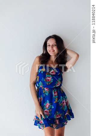 Smiling young woman in a blue dress. 118840214