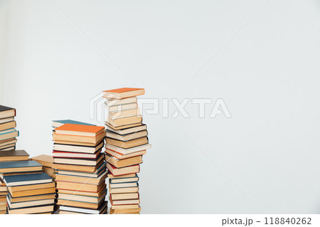 Stacks of educational books for teaching in the library on a white background 118840262