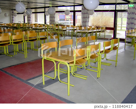 Empty classroom with desks and chairs at school. 118840417