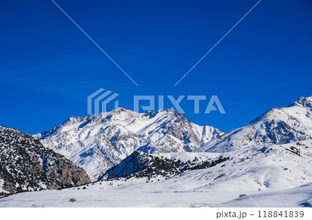 Winter landscape with mountains covered snow under blue sky in cold sunny day 118841839