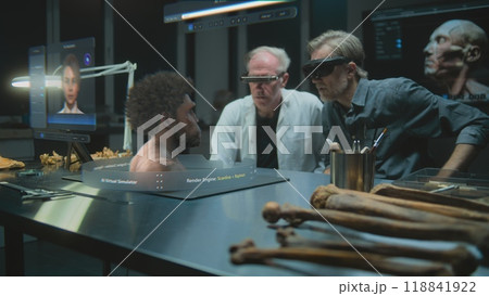 Two archaeologists in VR headsets. 3D graphics of AI simulator of ancient Neanderthal human Two archaeologists in VR headsets. 3D graphics of AI simulator of ancient Neanderthal human 118841922
