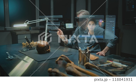 Archaeologist in VR headset conducts historical research using AI assistant and web browser in AR Archaeologist in VR headset conducts historical research using AI assistant and web browser in AR 118841931