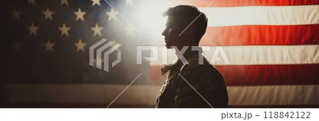 Profile of an American soldier against the flag, evoking national pride. Veterans and Memorial Day remembrance. 118842122