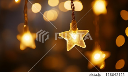 Close-up of glowing star-shaped light decoration with warm bokeh background. Festive Christmas lights and holiday ambiance. 118842123