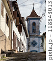 Historic Cobblestone Street Leading to a Blue Church 118843013