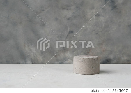 Empty pedestal or product display concrete podium with dry minimalistic flowers and nature leaves on green background. Copy space. Empty pedestal or product display concrete podium with dry minimalistic flowers and nature leaves on green background. Copy space. 118845607