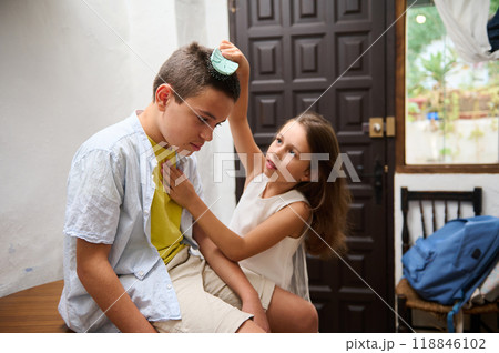 Young girl comforting sad boy with thoughtful gesture indoors Young girl comforting sad boy with thoughtful gesture indoors 118846102
