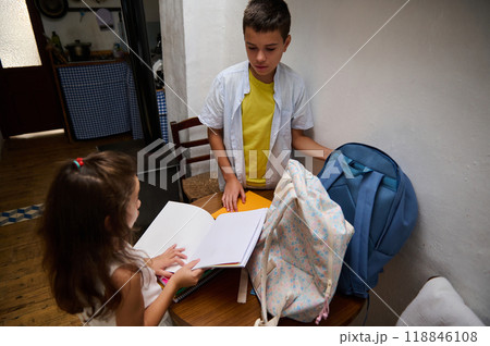 Children preparing for school with backpacks and books Children preparing for school with backpacks and books 118846108