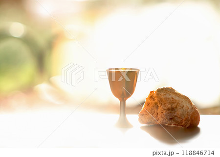 The Holy Communion bread and wine symbolizing the holy blood and body of Jesus Christ, the Last Supper background The Holy Communion bread and wine symbolizing the holy blood and body of Jesus Christ, the Last Supper background 118846714