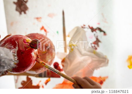 Hand of a child colouring a handmade styrofoam snowman Hand of a child colouring a handmade styrofoam snowman 118847021