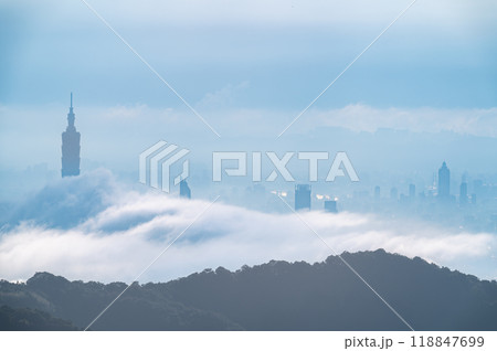 Misty Metropolis: A City Silhouette Veiled in Fog. Misty Metropolis: A City Silhouette Veiled in Fog. 118847699