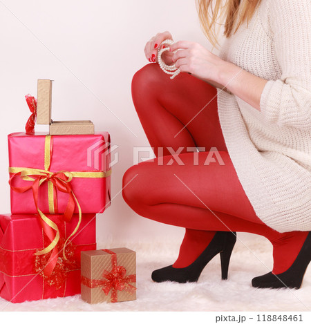 Woman with many christmas gift boxes Woman with many christmas gift boxes 118848461