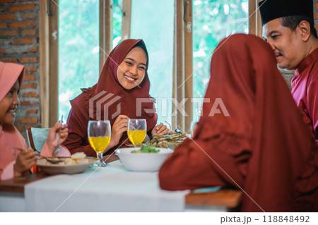 Enjoy a Cultural Family Gathering with a Traditional Meal full of Laughter and Joy 118848492