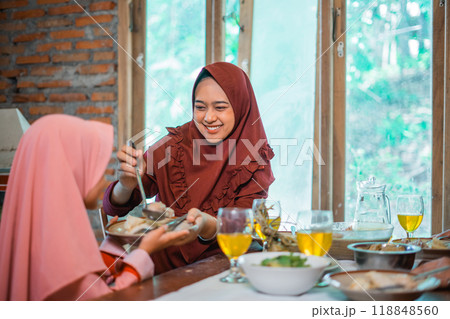 Enjoy a Warm Family Meal Sharing Delicious Moments Together at the Table, 118848560