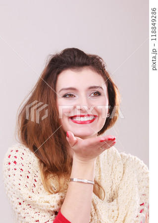 Beautiful woman blowing kiss 118849286