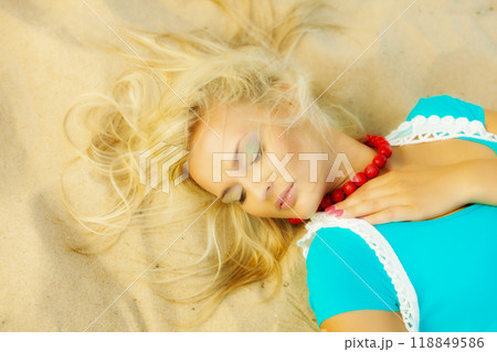 Beautiful blonde girl on sandy beach, portrait Beautiful blonde girl on sandy beach, portrait 118849586