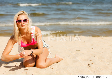 Pretty girl on beach. 118849672