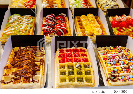 Belgian waffles with colorful sweet toppings and fruits for sale in Brussels, Belgium 118850002