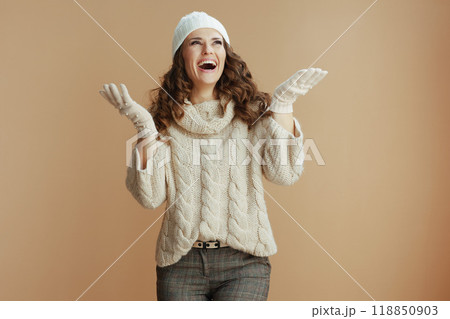 smiling elegant 40 years old woman catching snow 118850903
