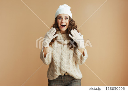 surprised elegant 40 years old woman isolated on beige 118850906