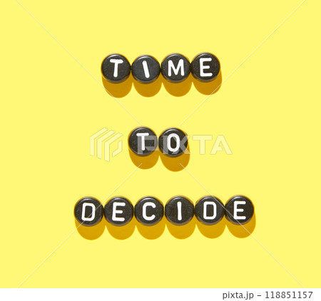 Bold time to decide message displayed on bright yellow background with black 118851157
