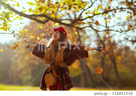 happy stylish female in red hat with scarf rejoicing happy stylish female in red hat with scarf rejoicing 118851519