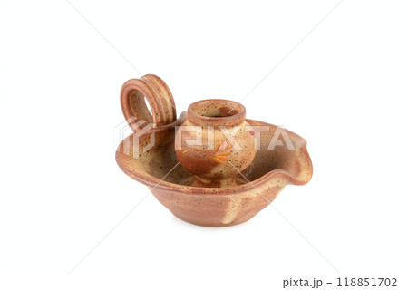 Clay candlestick isolated on white. 118851702