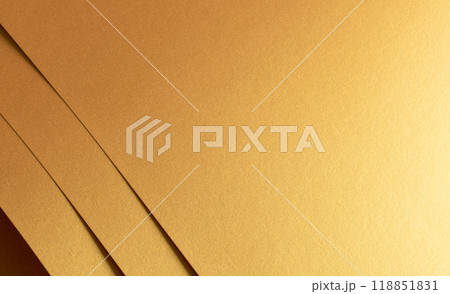 Golden metallic paper with a layered texture and warm brass and yellow tones. The minimalist, 118851831