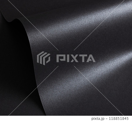 Black paper with a textured surface and minimalist, monochrome background. The premium structure 118851845